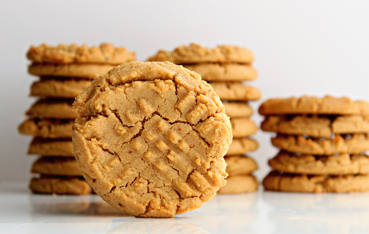 stacks of paleo peanut butter cookies on a countertop