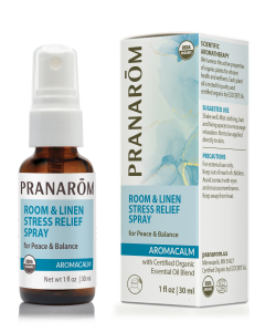 Pranarom Aromacalm Room and Linen Stress Relief Spray, in a 1 fl. oz. glass amber bottle with a chic blue and white label.