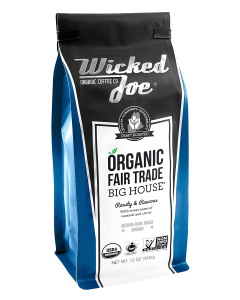 A black and cobalt blue bag of organic fair trade coffee.