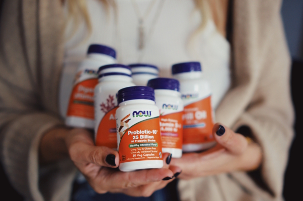 Woman holding Vitamins and Supplements